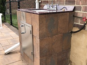 custom outdoor sink vanity nicolock verona block granite top and steel access door